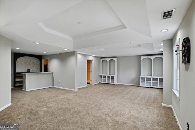 below grade area with carpet floors, recessed lighting, baseboards, and visible vents