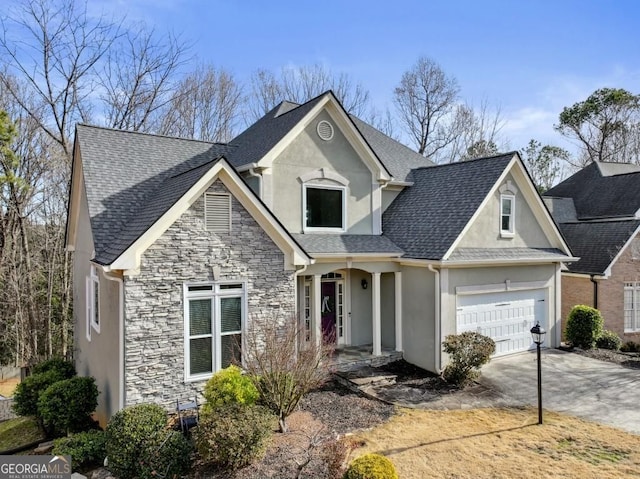 traditional home with an attached garage, stucco siding, driveway, and stone siding
