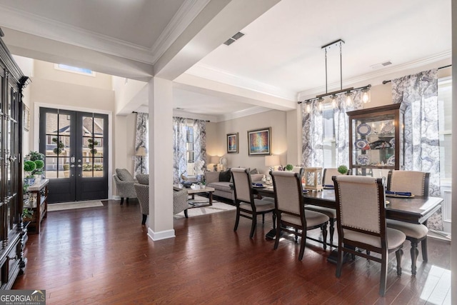 dining area with french doors, crown molding, and dark wood-type flooring