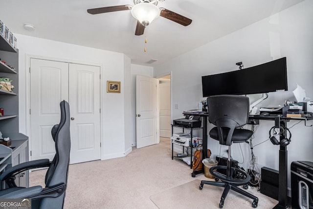 carpeted office with ceiling fan