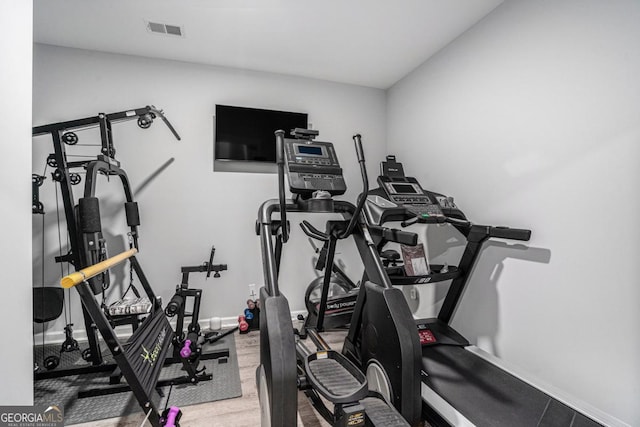 exercise area featuring wood-type flooring