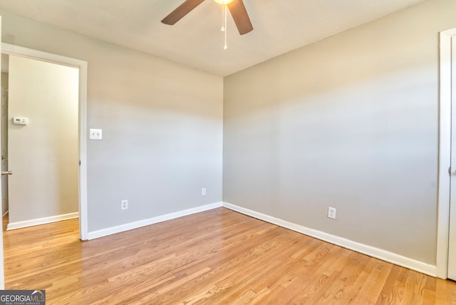 spare room featuring ceiling fan and light hardwood / wood-style floors