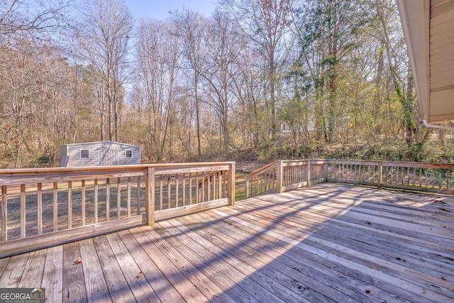 deck featuring a shed