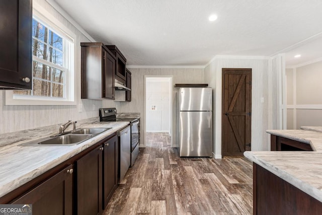 kitchen featuring sink, dark brown cabinetry, ornamental molding, and stainless steel appliances