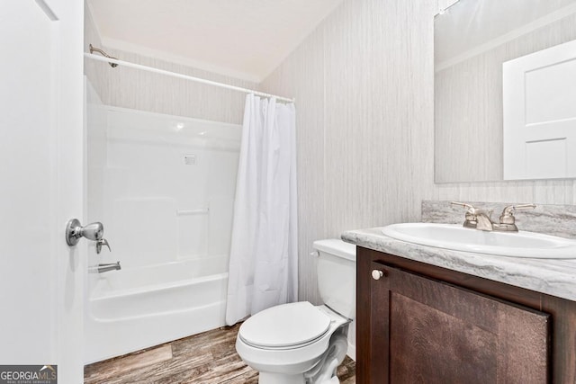 full bathroom with toilet, vanity, shower / tub combo with curtain, and hardwood / wood-style floors