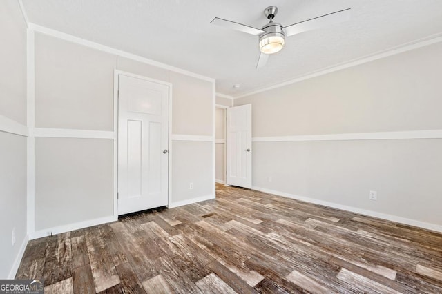 interior space featuring ceiling fan, ornamental molding, and hardwood / wood-style flooring