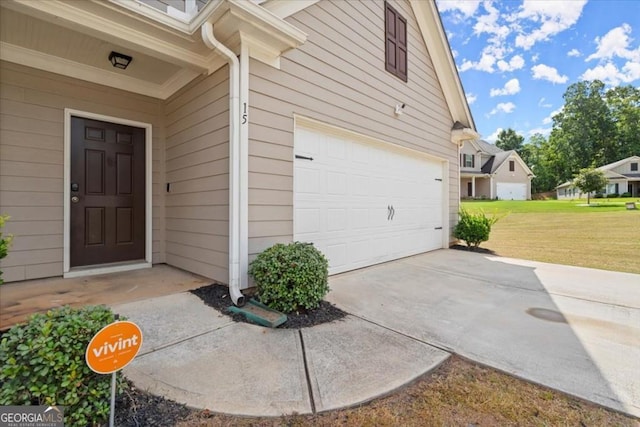 exterior space featuring a garage and a yard