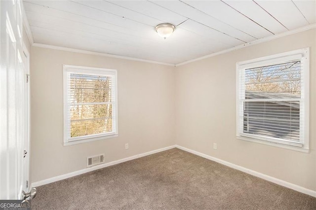 carpeted spare room featuring ornamental molding and wooden ceiling