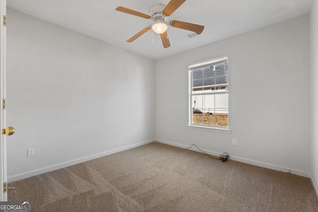 unfurnished room with carpet and ceiling fan