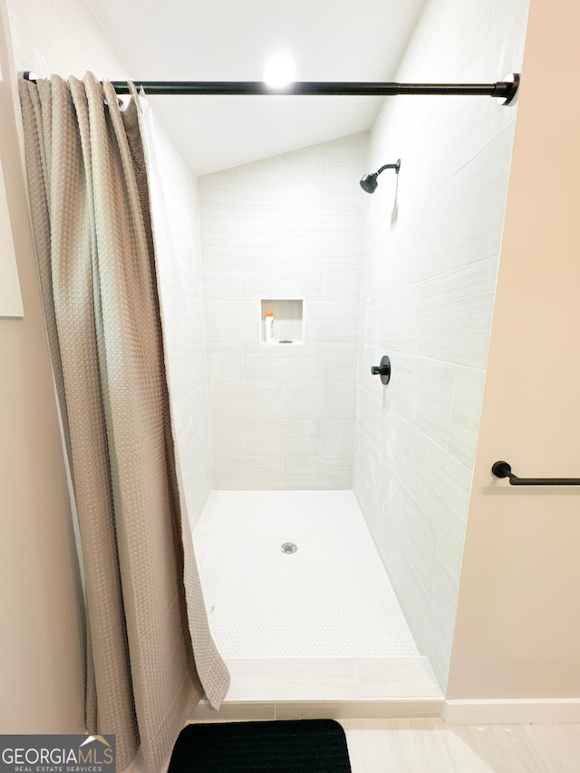 bathroom with a shower with curtain