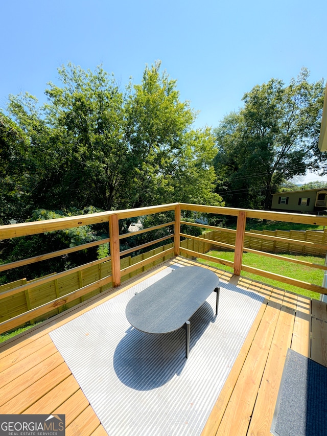 deck featuring a yard