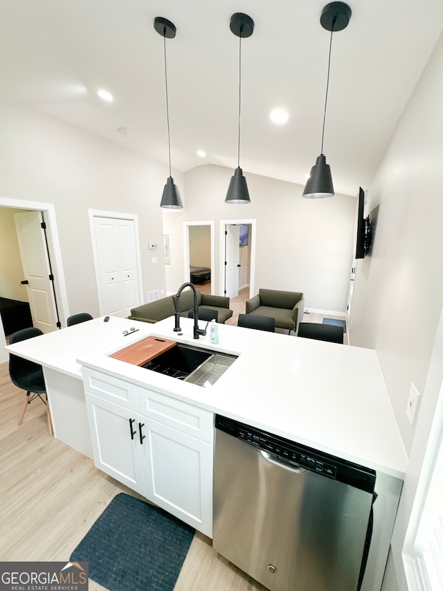 kitchen with white cabinetry, light hardwood / wood-style floors, dishwasher, pendant lighting, and sink