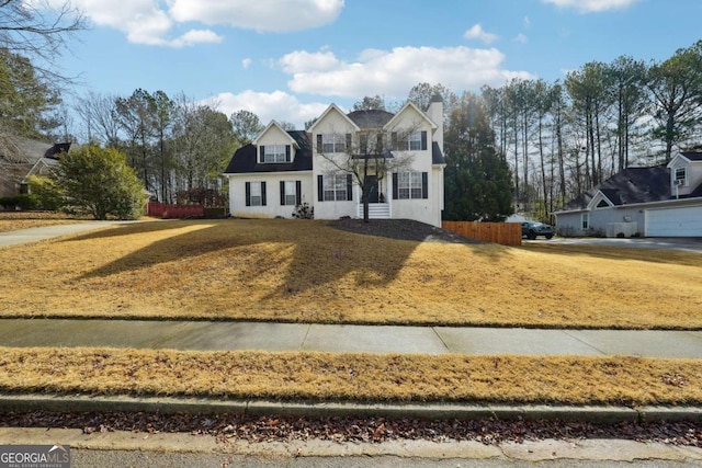 view of property with a front lawn