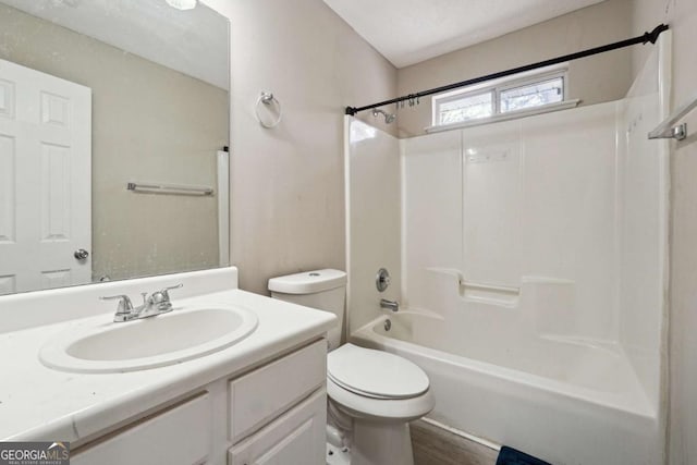 full bathroom featuring toilet, tub / shower combination, wood-type flooring, and vanity