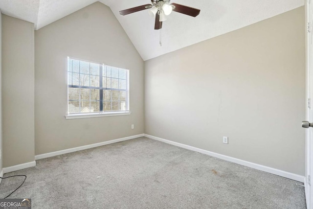 empty room with light carpet, ceiling fan, and lofted ceiling