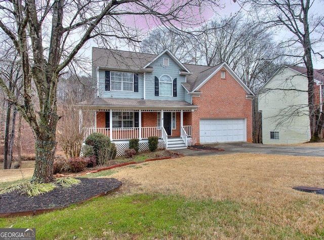 front facade with a front lawn, covered porch, and a garage