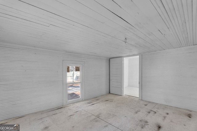 empty room featuring wooden ceiling