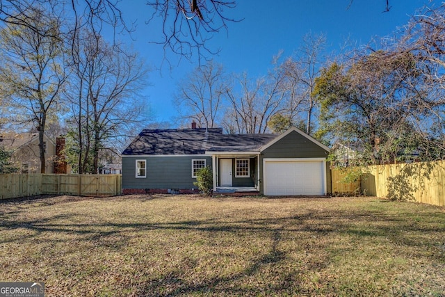 ranch-style house featuring a garage and a front lawn