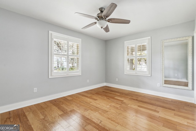 empty room featuring light hardwood / wood-style floors and ceiling fan