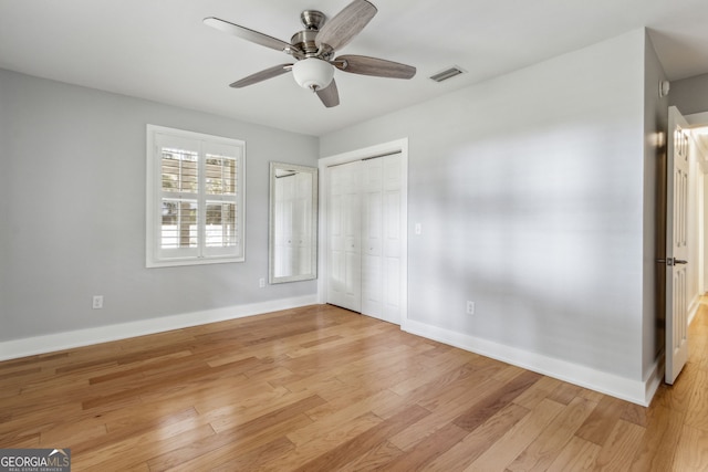 unfurnished bedroom featuring ceiling fan and light hardwood / wood-style floors