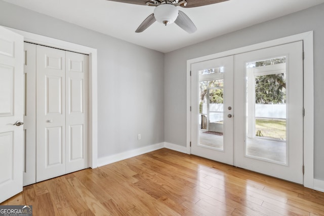 doorway with french doors and light wood-type flooring