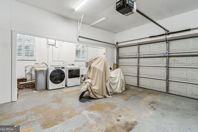 garage featuring a garage door opener and washing machine and dryer