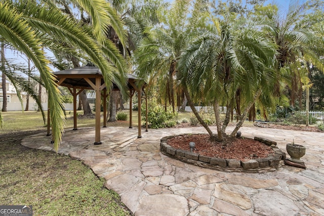 view of property's community featuring a gazebo and a patio