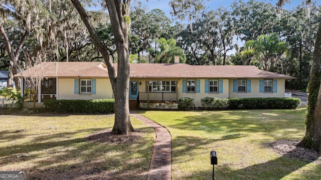 ranch-style house with a front yard