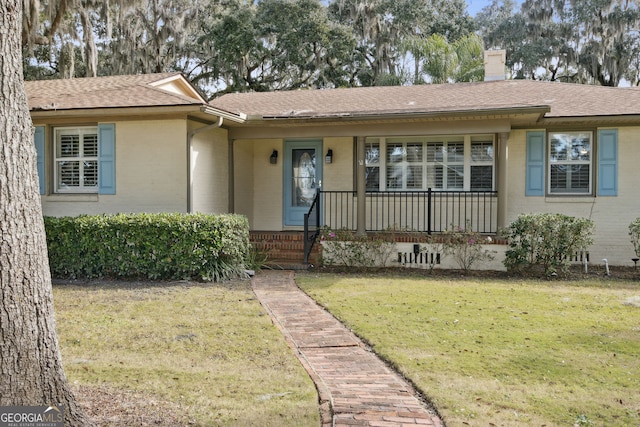 ranch-style home with a front yard