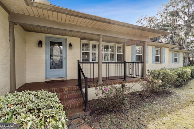 property entrance featuring covered porch