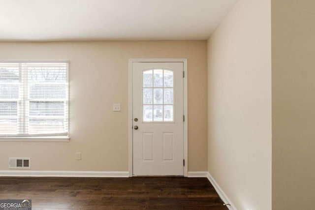 doorway with dark hardwood / wood-style flooring