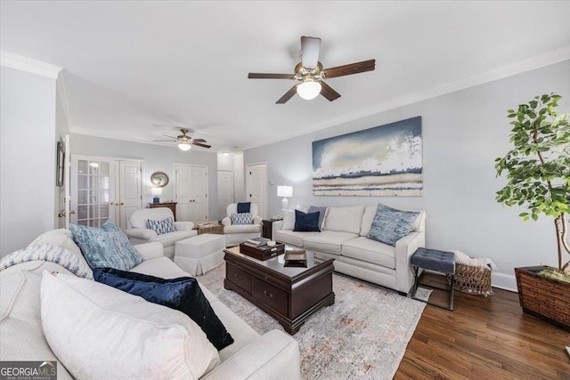 living room featuring ceiling fan, dark hardwood / wood-style flooring, crown molding, and french doors