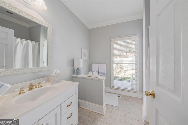 bathroom with vanity and ornamental molding