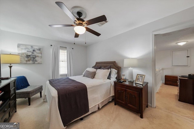 bedroom featuring light carpet and ceiling fan