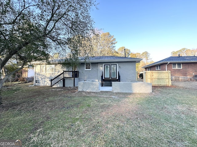 back of house with a yard