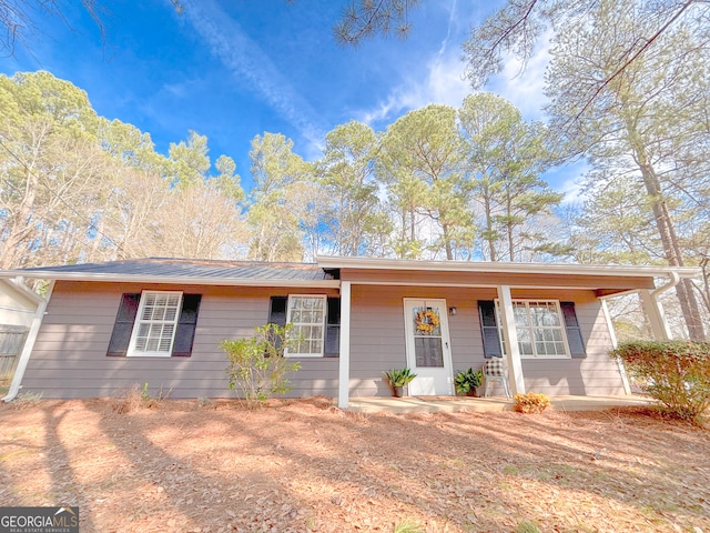 single story home featuring a porch