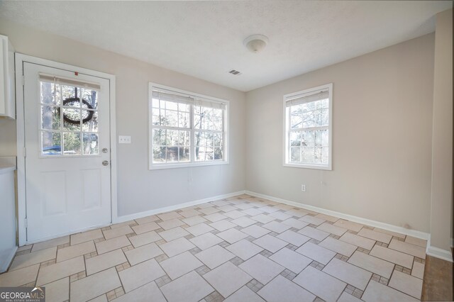 unfurnished room with ceiling fan and light wood-type flooring