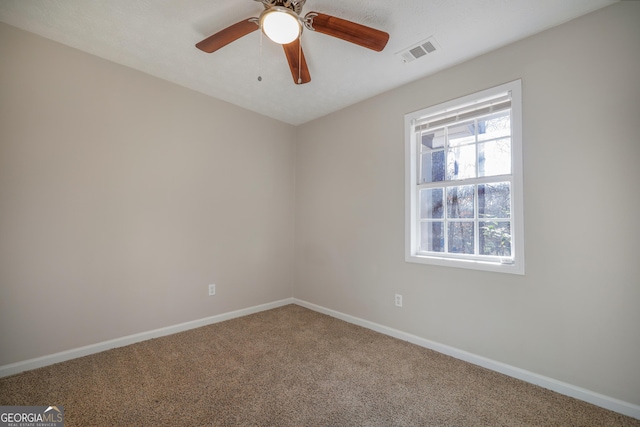 unfurnished bedroom with light colored carpet and ceiling fan