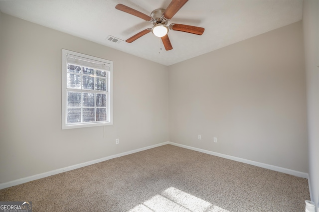 carpeted empty room with ceiling fan