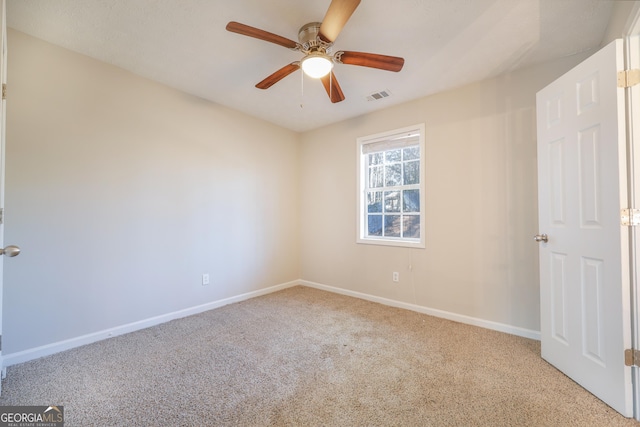 unfurnished bedroom with light colored carpet and ceiling fan