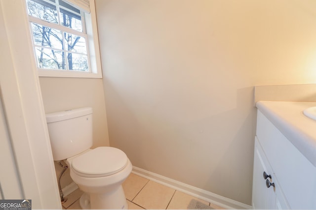 unfurnished bedroom featuring ensuite bath and light colored carpet