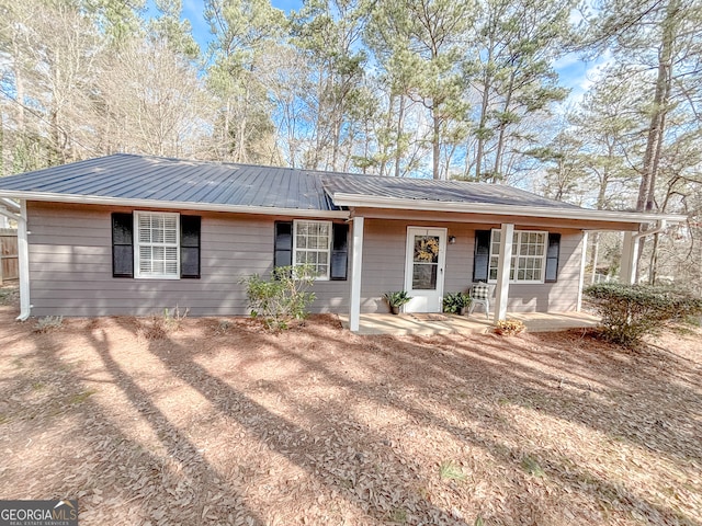 doorway to property featuring covered porch