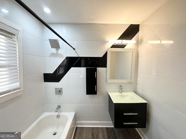 bathroom featuring vanity, wood-type flooring, and  shower combination