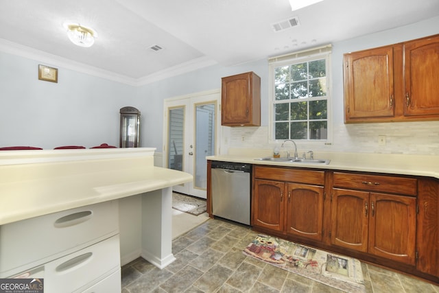 kitchen featuring crown molding, stainless steel dishwasher, sink, and decorative backsplash