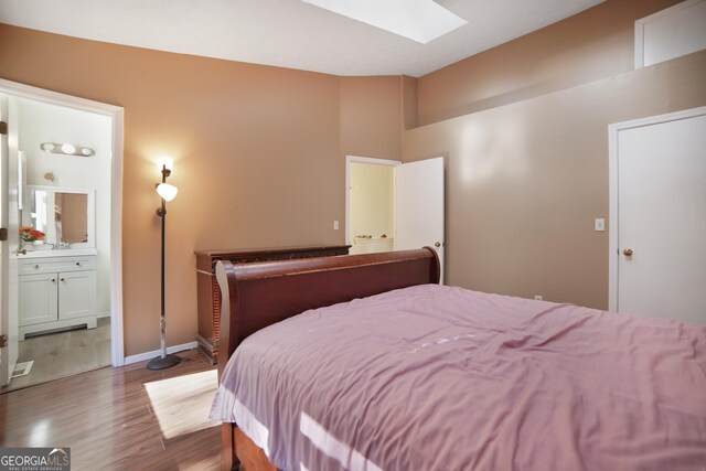 carpeted bedroom with vaulted ceiling and multiple windows