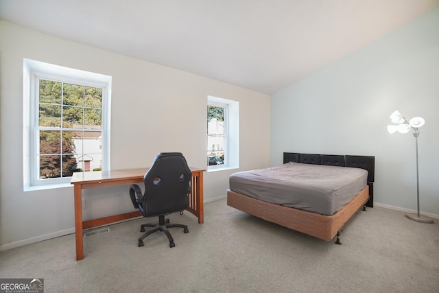 carpeted bedroom featuring vaulted ceiling