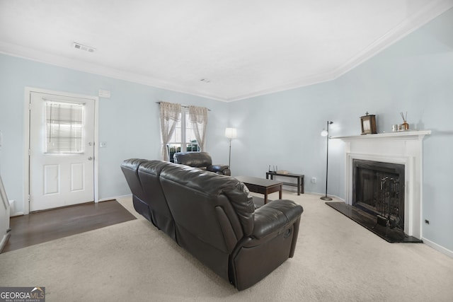 living room featuring crown molding and carpet floors