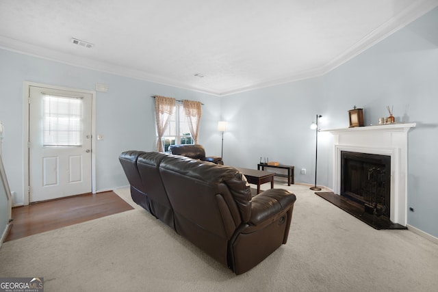 carpeted living room featuring crown molding