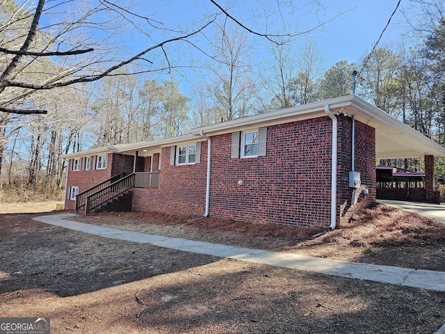 view of property exterior with a carport