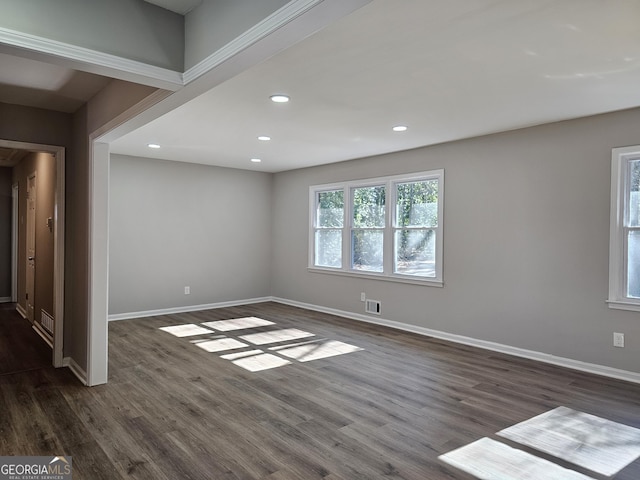 empty room featuring dark hardwood / wood-style flooring